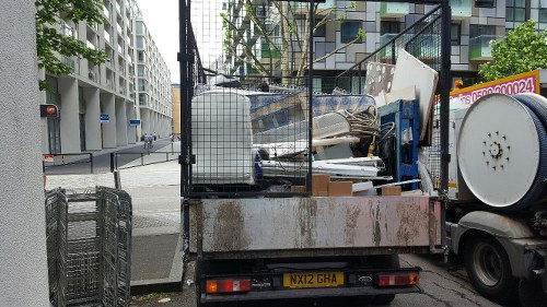 Man and van crew loading furniture in a flat
