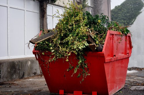 Mid-sized skip on a residential street ready for loading